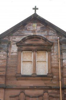 View of gabled wallhead and pedimented, mullioned window to outer left bay of north elevation, taken from the north.