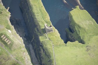 Oblique aerial view of Castle of Old Wick, looking ENE.