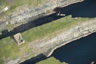 Oblique aerial view of Castle of Old Wick, looking N.