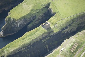 Oblique aerial view of Castle of Old Wick, looking S.