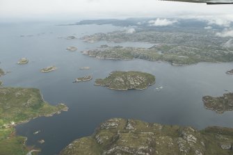 General oblique aerial view of Loch Laxford and Loch Dughaill centred on Eilean Ard, looking NE.