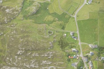Oblique aerial view of Stoer village and Parliamentary Church, looking SSE.