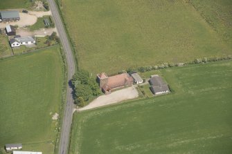 Oblique aerial view of St Molio's Church, looking to the NE.