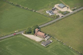 Oblique aerial view of St Molio's Church, looking to the NNW.