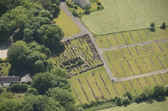 Oblique aerial view of Kilbride Chapel and churchyard, looking to the SSW.