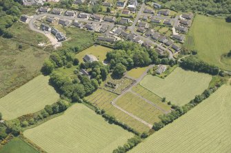 Oblique aerial view of Kilbride Chapel and churchyard, looking to the SSE.