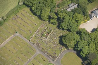 Oblique aerial view of Kilbride Chapel and churchyard, looking to the NE.