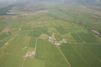 General oblique aerial view of the field systems around the village of Sliddery, looking to the NE.