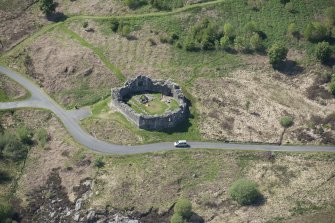 Oblique aerial view of the re-erected site of Loch Doon Castle, looking to the NW.