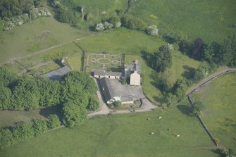 Oblique aerial view of Buittle Place Tower House, looking to the ESE.