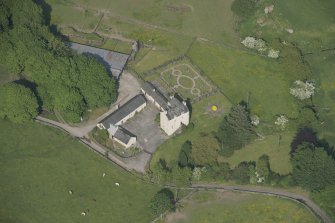 Oblique aerial view of Buittle Place Tower House, looking to the ENE.