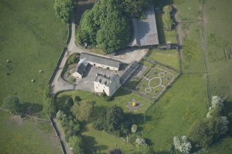 Oblique aerial view of Buittle Place Tower House, looking to the N.