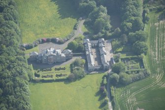 Oblique aerial view of Arbigland House and stable block, looking to the SW.