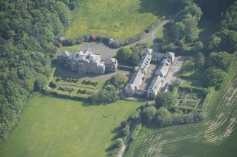 Oblique aerial view of Arbigland House and stable block, looking to the S.