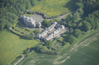 Oblique aerial view of Arbigland House and stable block, looking to the SSE.