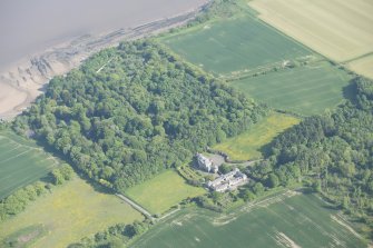 Oblique aerial view of Arbigland House, stable block and walled garden, looking to the SSE.