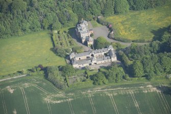 Oblique aerial view of Arbigland House and stable block, looking to the SE.