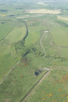 General oblique aerial view of the tracked target and Glennap fort with Chapel Hill in the distance, looking N.