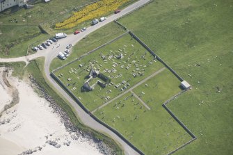 Oblique aerial view of Balnakeil Parish Church and Churchyard, looking to the E.