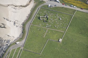 Oblique aerial view of Balnakeil Parish Church and Churchyard, looking to the E.