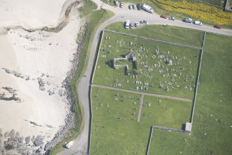 Oblique aerial view of Balnakeil Parish Church and Churchyard, looking to the ESE.