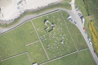Oblique aerial view of Balnakeil Parish Church and Churchyard, looking to the NE.