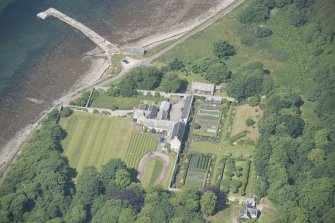 Oblique aerial view of Tongue House and walled garden, looking to the NNE.