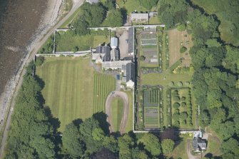 Oblique aerial view of Tongue House and walled garden, looking to the NNE.