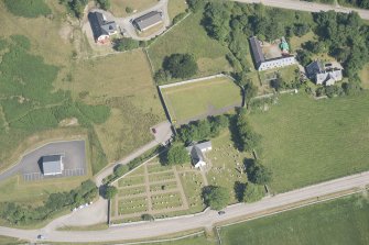 Oblique aerial view of Tongue Farmstead and Manse, St Andrew's Church and graveyard, looking to the SE.