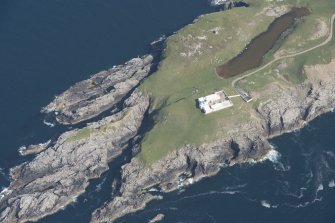 Oblique aerial view of Strathy Point Lighthouse, looking to the NW.