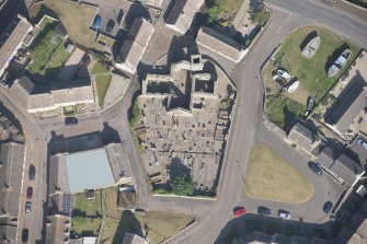 Oblique aerial view of Old St Peter's Church and burial gound, looking to the E.