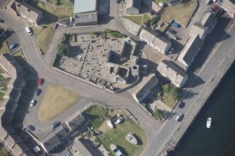 Oblique aerial view of Old St Peter's Church and burial gound, looking to the N.