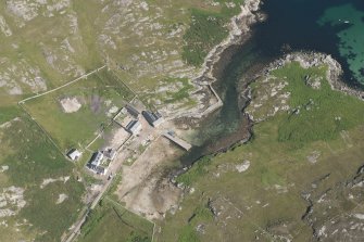 Oblique aerial view of Rispond Fishing Station, pier and quay, looking to the ESE.