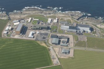 Oblique aerial view of Dounreay and Nuclear Research Facility, looking to the NW.