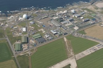 Oblique aerial view of Dounreay and Nuclear Research Facility, looking to the NW.