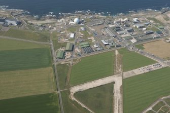 Oblique aerial view of Dounreay and Nuclear Research Facility, looking to the NW.