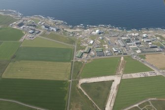 Oblique aerial view of Dounreay, Nuclear Research Facility and airfield, looking to the NW.