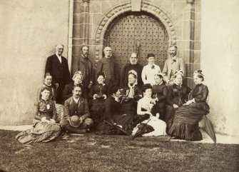 View of family group by gatehouse in Seton Tower, Fyvie Castle.
Titled: 'Group at 'Fyvie Castle'.
PHOTOGRAPH ALBUM NO 4: INNES OF COWIE ALBUM
