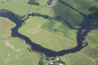 Oblique aerial view of the cropmarks of the enclosure on Lodge Island, looking SE.