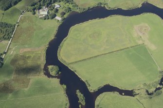 Oblique aerial view of the cropmarks of the enclosure on Lodge Island, looking N.