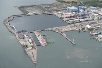 Oblique aerial view of the dockyard at Rosyth, looking W.