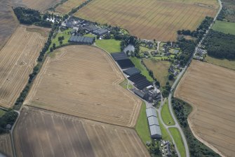 Oblique aerial view of the Benriach and Longmorn distilleries, looking SSE.