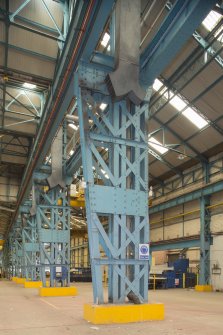 Interior. Central Yard, Steel preparation workshop. Stanchions dividing North and South Bays at the West end with integral EOT crane rails. These sanchions date from 1906.