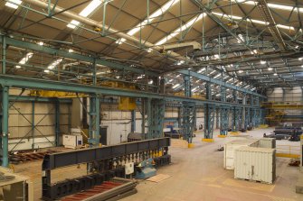 Interior. Central Yard, Steel preparation workshop. General view from North East. The junction between the 1950s extension (nearest the camera) and the original 1906 boiler shop clearly shown. Note the remnants of window voussoirs middle of the image. The wall below has been remodelled.