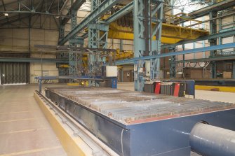 Interior. Central Yard, Steel preparation workshop, South Bay, West End (1906). View of CNC plasma burner.