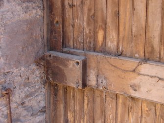 Detail of wooden lock on interior of central door at ground-floor level in the north wall from a Standing Building Survey, Glamis Mill, Glamis, Angus.