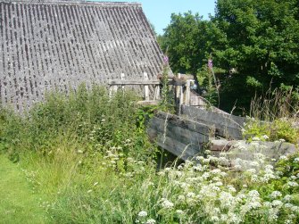 Exterior view of the mill showing the sluice, from a Standing Building Survey, Glamis Mill, Glamis, Angus.