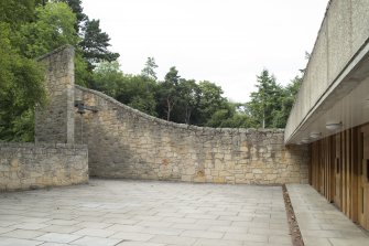 View of entrance and bell in wall recess from south west.