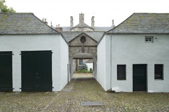 Pend and archway to courtyard from north west.