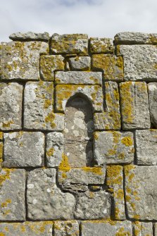 Detail of blocked opening on south facade of priory church